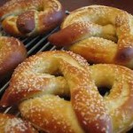Soft pretzels on a wire rack.