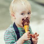 Messy kid eating ice cream